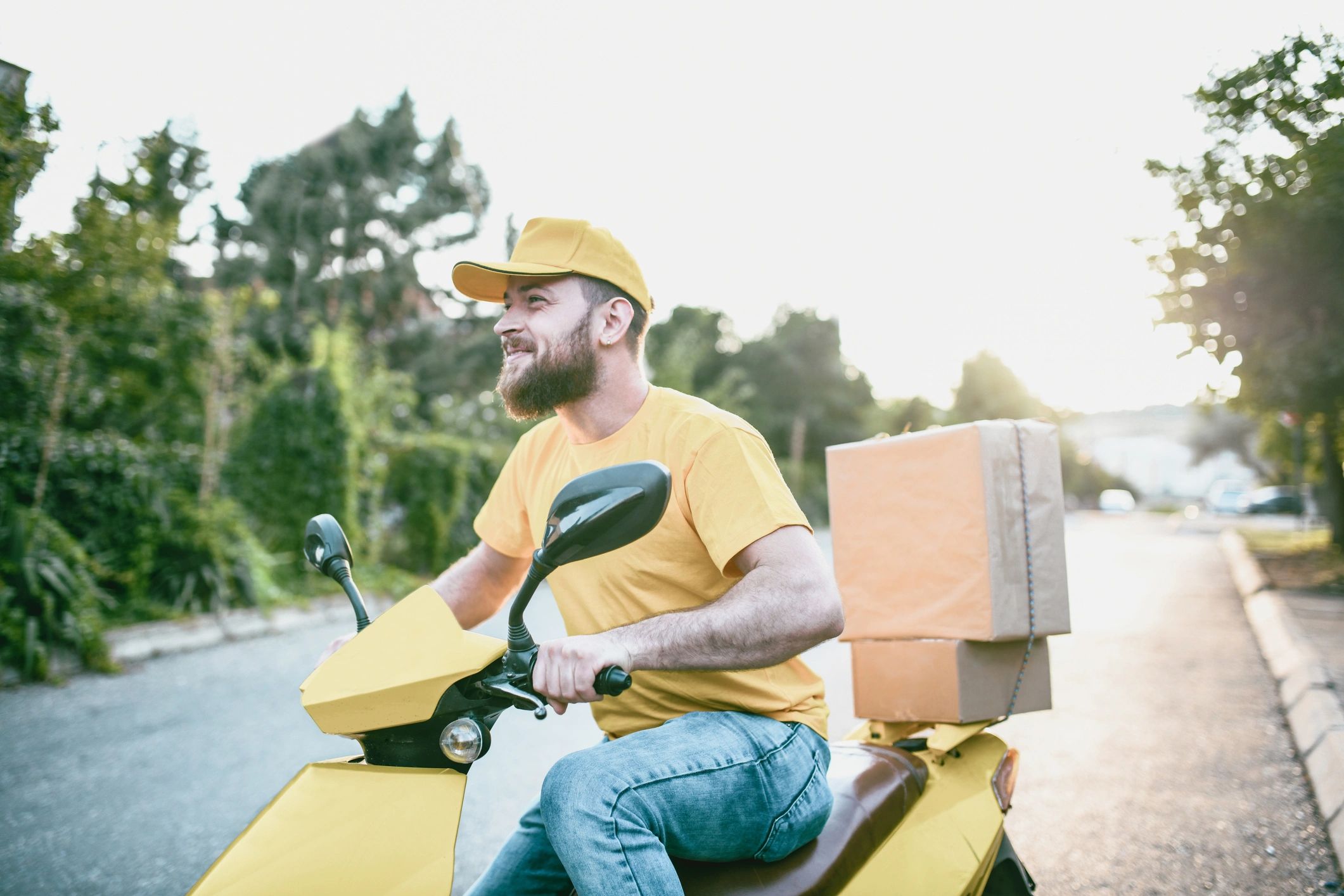 Person on a scooter delivering packages