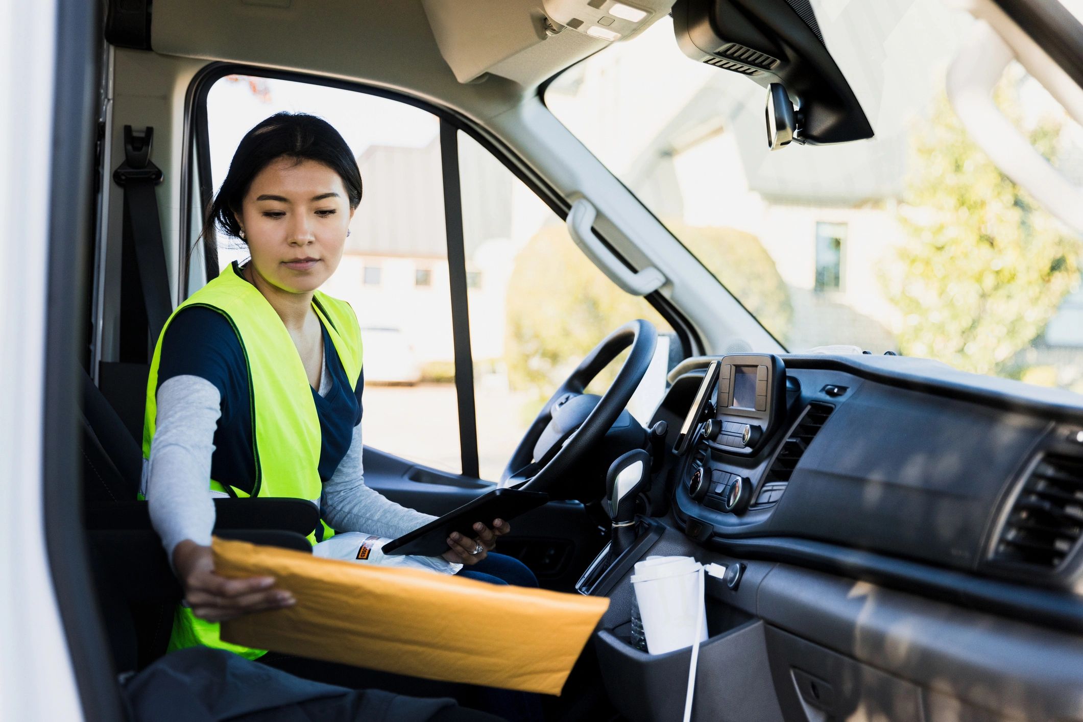 Delivery driver holding a package