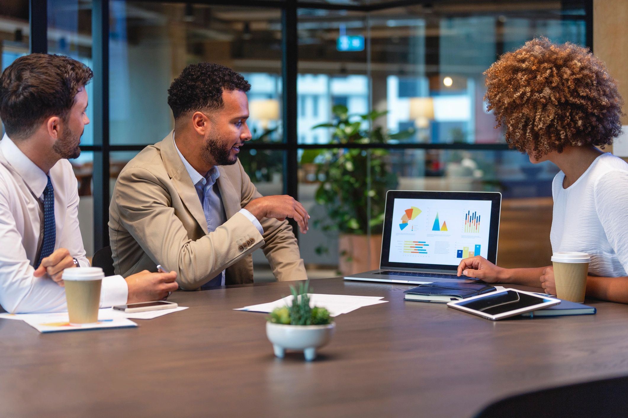 Business professionals reviewing a laptop
