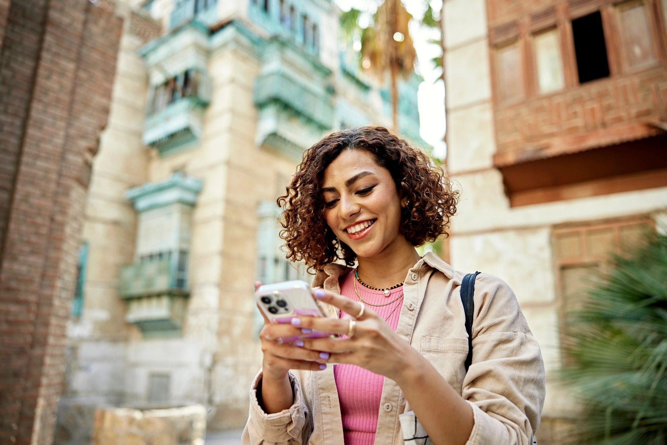 Person using a smartphone map app to search nearby places