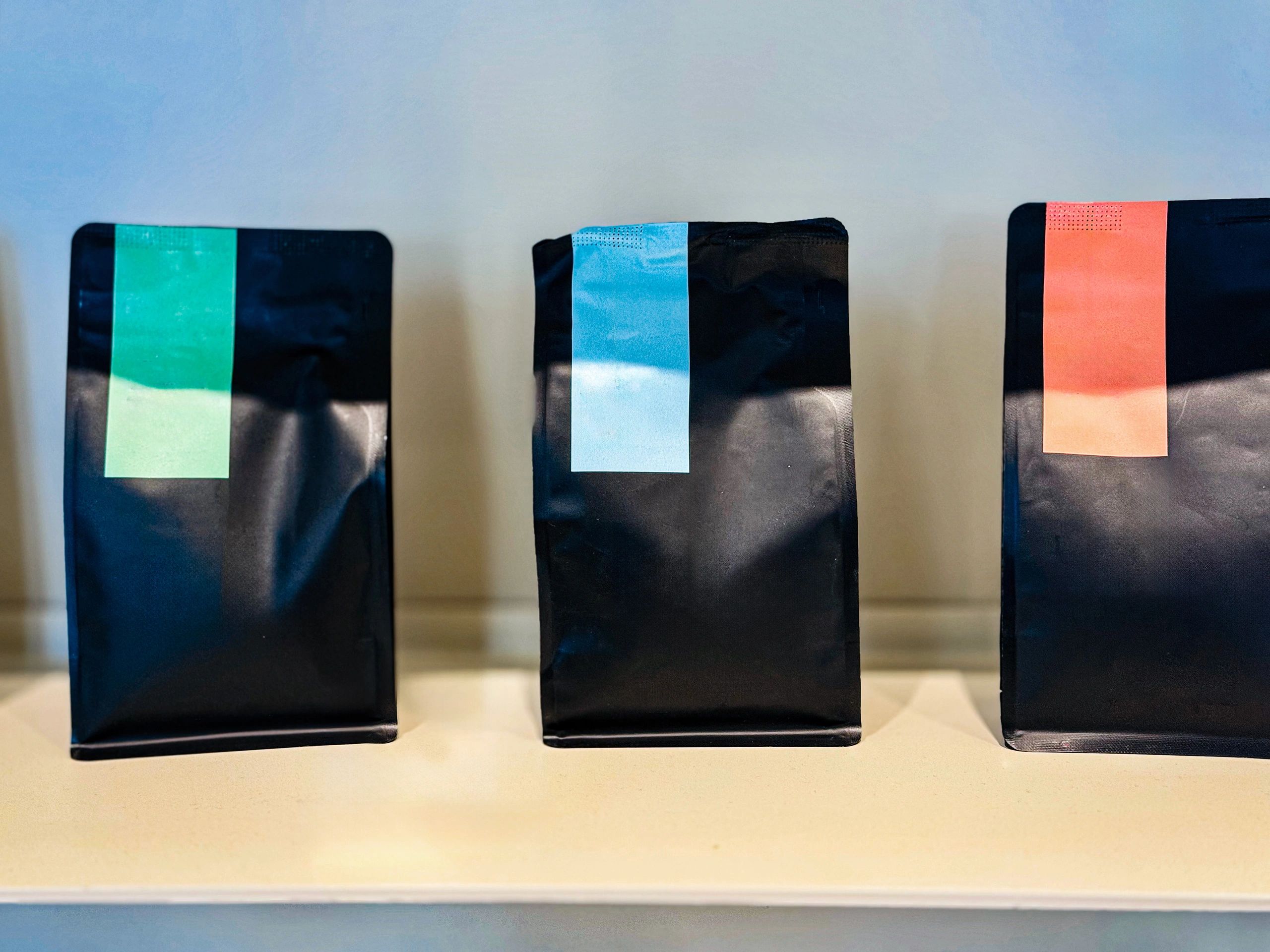 Three packaged products displayed on a shelf