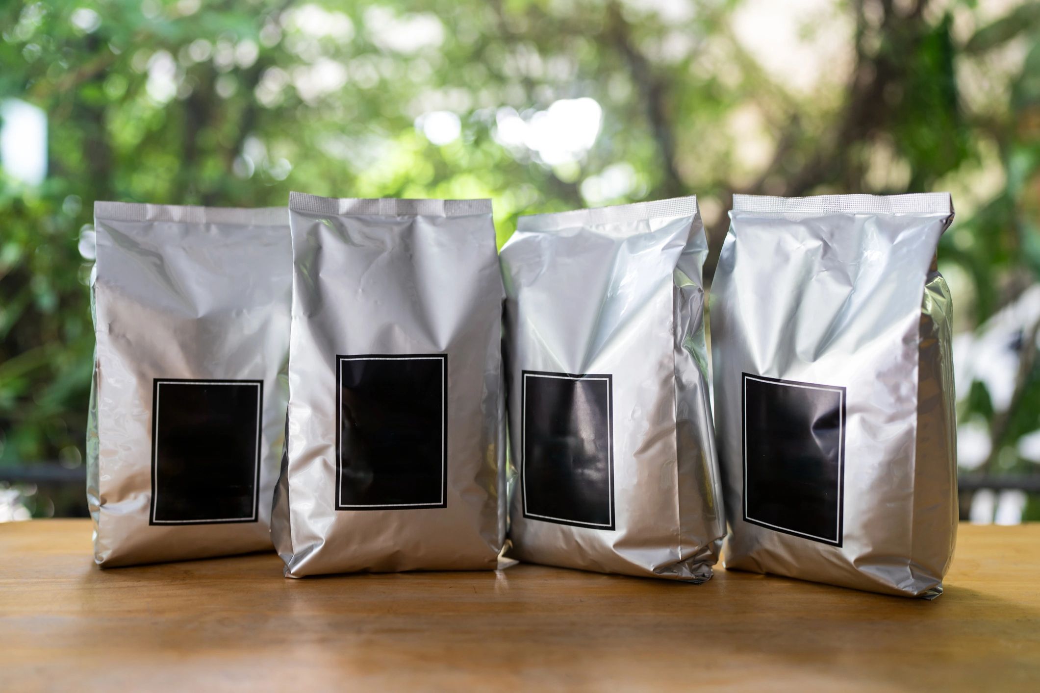 Row of packaging with blank black labels