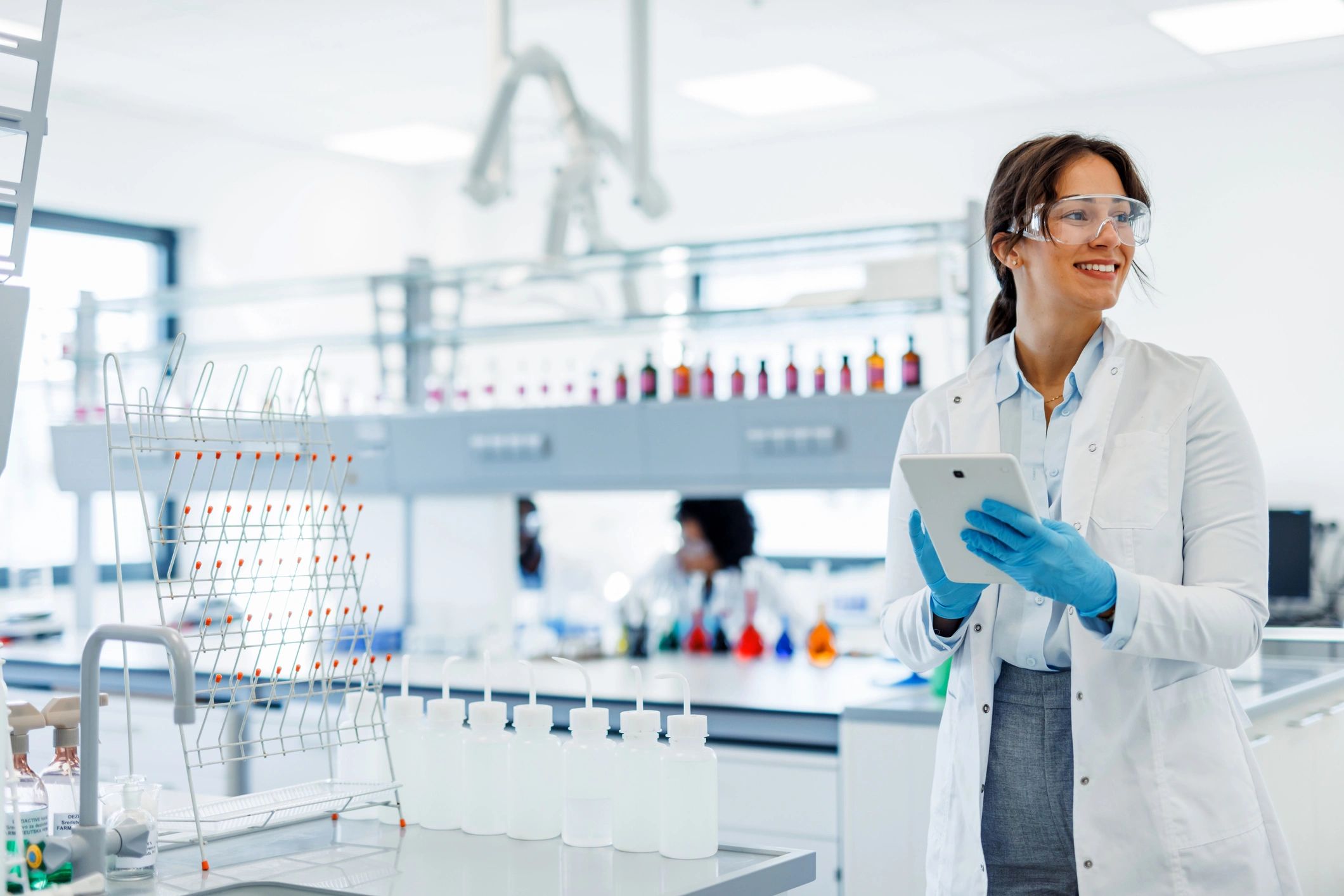 Scientist working with a digital tablet in a modern laboratory
