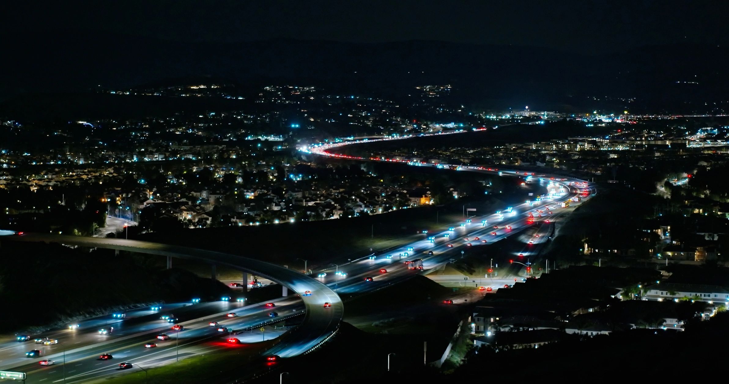Night aerial view of Los Angeles area freeway representing city-wide service coverage